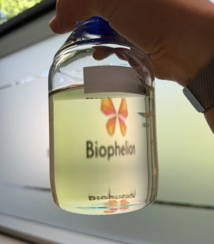 Biophelion fermentation-grown specialty ingredient in a laboratory vial